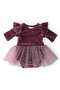 Purple velvet dress with ruffled sleeves and a tulle skirt on a white background
