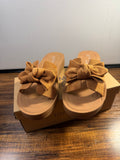 Brown sandal with a decorative denim fabric bow