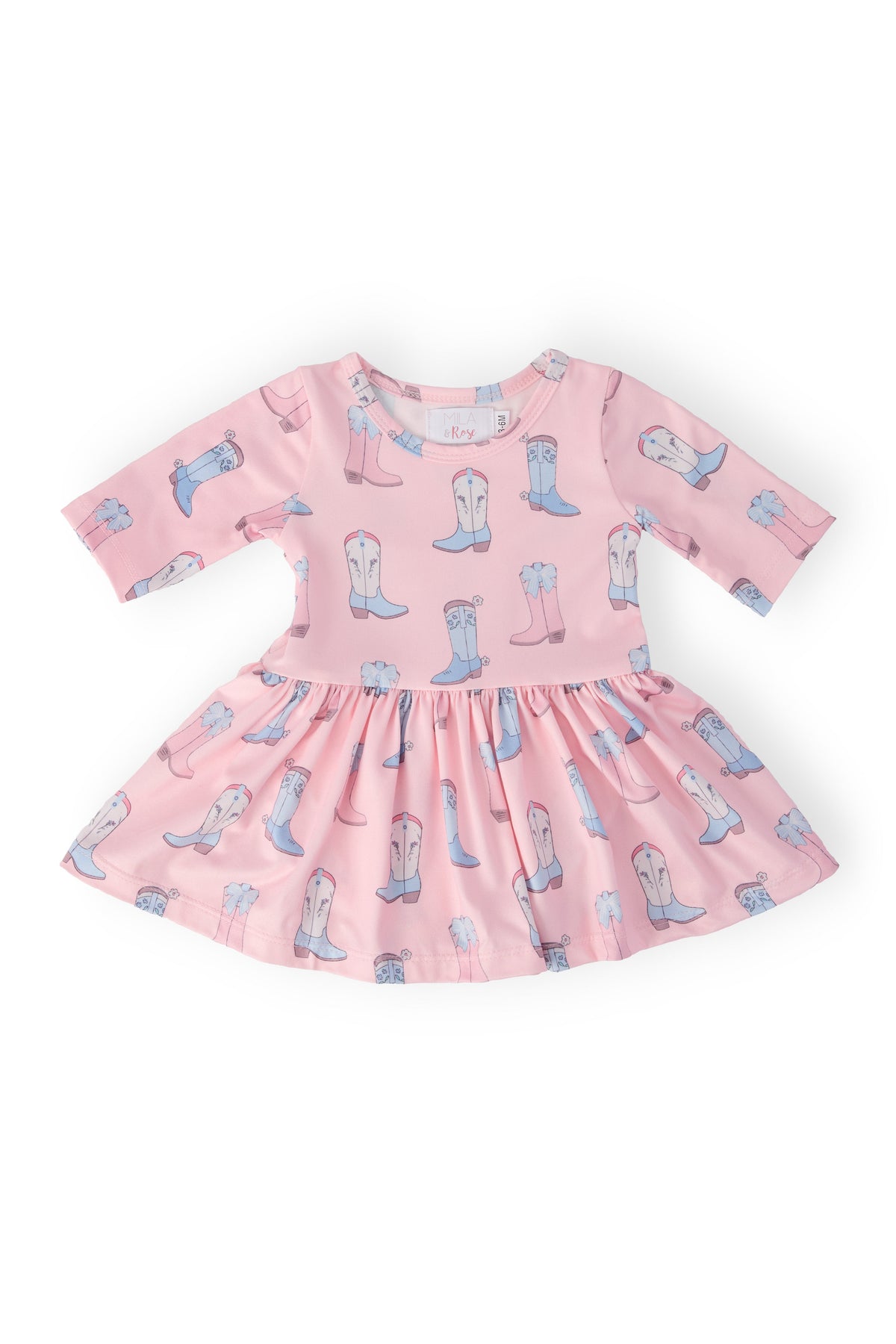 Pink dress with cowboy boot pattern on a white background